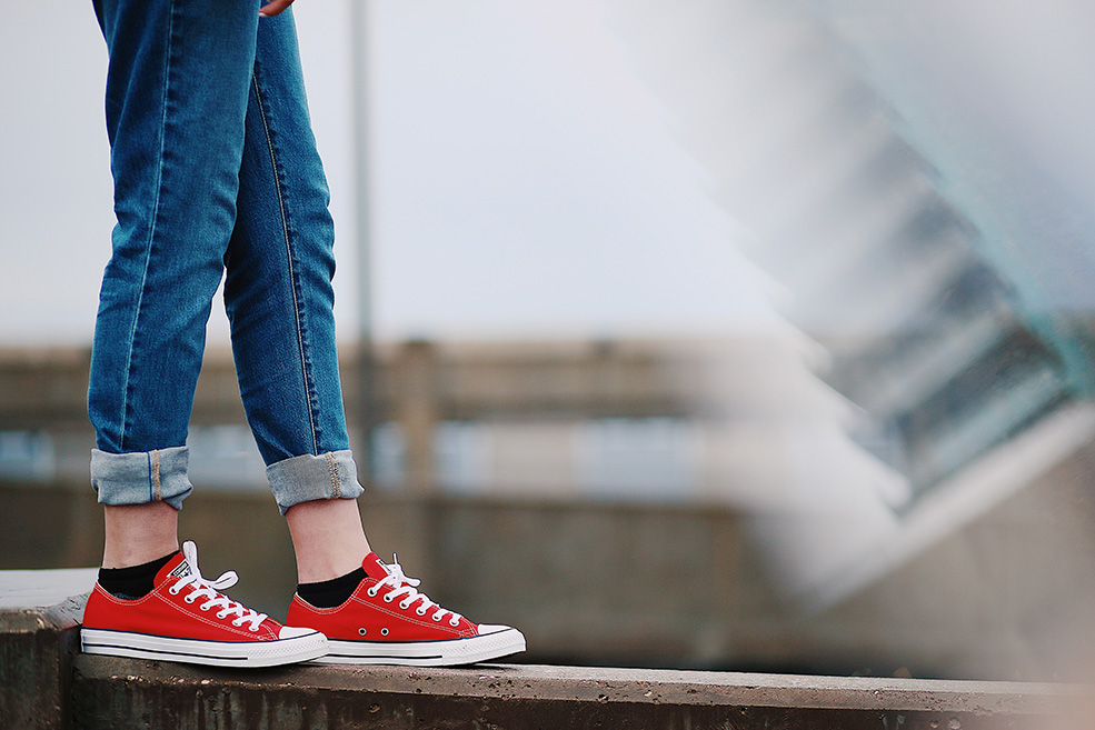 Stock image of person wearing red shoes